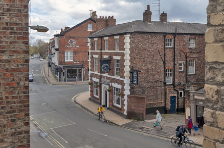York, England - April 2018: Old brick buildings at street corner on Monkgate and St Maurice Road in historic district of City of York, England, UKのeditorial素材
