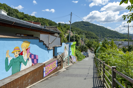 Jeonju, South Korea - September 2018: Colourful paintings and decorations on walls and buildings at Jaman Mural Village, popular tourist attraction, located near Jeonju Hanok Village in Jeonju, South Koreaのeditorial素材