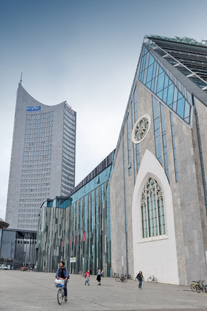 Leipzig, Germany - October 2018: Paulinum, Evangelical Church and Augusteum, main building of Leipzig University with City-Hochhaus Leipzig seen in background at Augustusplatz in downtown Leipzig Cityのeditorial素材