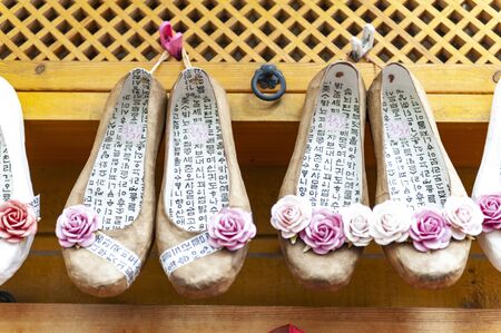 Busan, South Korea - April 2019: Korean traditional flower shoes with Korean characters, famous...