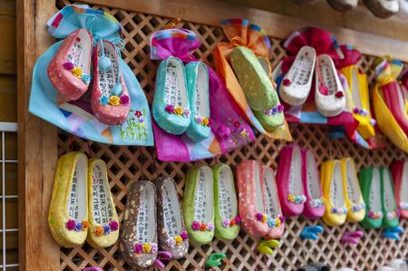 Busan, South Korea - April 2019: Korean traditional flower shoes with Korean characters, famous...