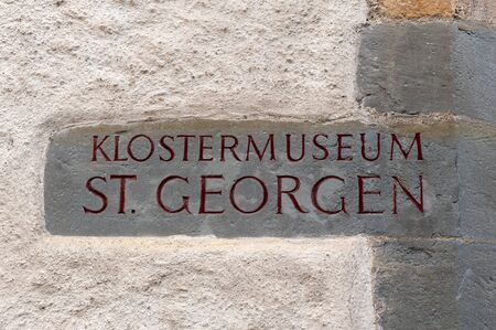 Stein Am Rhein, Switzerland - October 2019: Stone signage of St. George's Abbey Museum installed on the wall of the abbey in Stein am Rhein, Switzerlandのeditorial素材