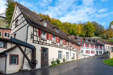 Schaffhausen, Switzerland - October 2019: Old buildings located along the narrow street from Neuhausen Rheinfall station to the Rhine Falls, famous and biggest waterfall in Europe on the Rhine River in Switzerlandのeditorial素材
