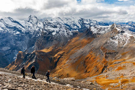 Lauterbrunnen, Switzerland - October 2019: Tourists hiking on the Schilthorn Ridge at the summit of Schilthorn mountain of the Swiss Alps in Switzerlandのeditorial素材