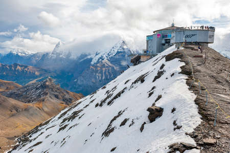 Lauterbrunnen, Switzerland - October 2019: Piz Gloria, the viewpoint, restaurant, and cable car terminal station located on the summit of Schilthorn mountain overlooking the Swiss Alps in Switzerlandのeditorial素材