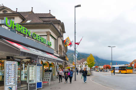 Interlaken, Switzerland - October 2019: Local businesses scene and retail stores located on station road in downtown Interlaken, a famous resort town destination in Switzerlandのeditorial素材