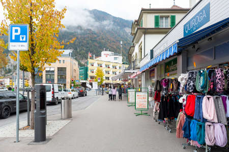 Interlaken, Switzerland - October 2019: Local businesses scene and retail stores located on station road in downtown Interlaken, a famous resort town destination in Switzerlandのeditorial素材