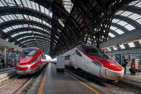 Milan, Italy - October 2019: High-speed trains approaching platforms at Milano Centrale, the main...