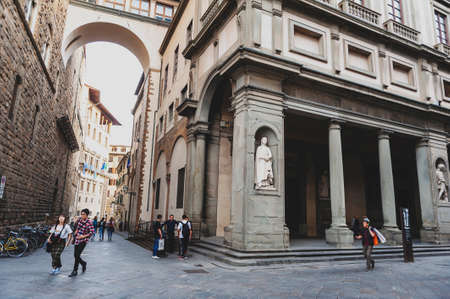 Florence, Italy - October 2019: Tourists walking by the Uffizi Gallery, an art museum located adjacent to the Piazza della Signoria in the historic centre of Florence, Italyのeditorial素材