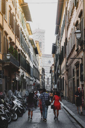 Florence, Italy - October 2019: Street in historic center of Florence, capital city of the Tuscany region of Italy, leading to Florence Cathedral of Saint Mary of the Flower (Santa Maria del Fiore)のeditorial素材