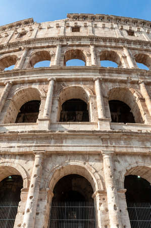 Architectural details of the facade of the Colosseum (Coliseum) or Flavian Amphitheatre, the largest Roman amphitheater located in city of Rome, Italyの写真素材