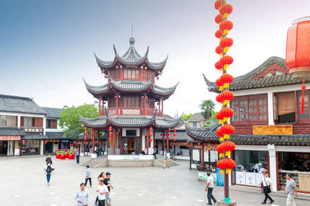 Shanghai, China - September 2019: The Bell Tower built in traditional Chinese architecture style located at the entrance to Qibao Old Street in Qibao Ancient Town, a historic water township of Qibao in the Minhang District of Shanghai, Chinaのeditorial素材