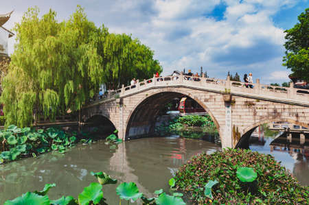 Shanghai, China - September 2019: Old bridges over the Puhui River in Qibao Ancient Town, a historic water township of Qibao in the Minhang District of Shanghai, Chinaのeditorial素材