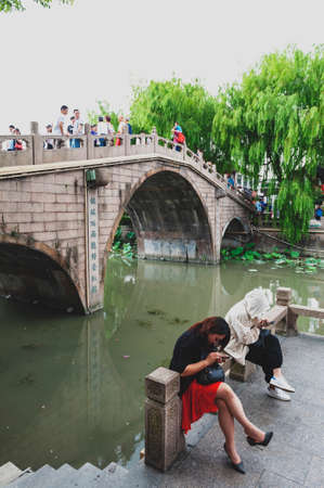 Shanghai, China - September 2019: Old bridges over the Puhui River in Qibao Ancient Town, a historic water township of Qibao in the Minhang District of Shanghai, Chinaのeditorial素材