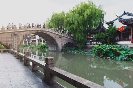 Shanghai, China - September 2019: Old bridges over the Puhui River in Qibao Ancient Town, a historic water township of Qibao in the Minhang District of Shanghai, Chinaのeditorial素材