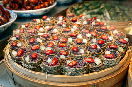 Local street food and snacks sold at the Qibao Old Street in Qibao Ancient Town, a historic water township of Qibao in the Minhang District of Shanghai, Chinaの写真素材