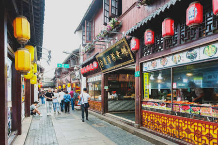 Shanghai, China - September 2019: Buildings and shophouses built in traditional Chinese architecture style located along the Qibao Old Street in Qibao Ancient Town, a historic water township of Qibao in the Minhang District of Shanghai, Chinaのeditorial素材