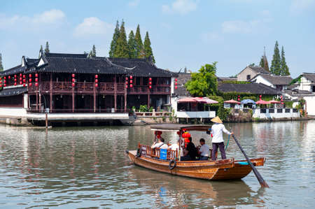 Shanghai, China - September 2019: Sightseeing tour on Chinese traditional rowboat in the Dianpu River in Zhujiajiao Ancient Water Town, a historic village and famous tourist destination in the Qingpu District of Shanghai, Chinaのeditorial素材