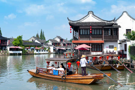 Shanghai, China - September 2019: Sightseeing tour on Chinese traditional rowboat in the Dianpu River in Zhujiajiao Ancient Water Town, a historic village and famous tourist destination in the Qingpu District of Shanghai, Chinaのeditorial素材