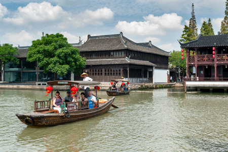 Shanghai, China - September 2019: Sightseeing tour on Chinese traditional rowboat in the Dianpu River in Zhujiajiao Ancient Water Town, a historic village and famous tourist destination in the Qingpu District of Shanghai, Chinaのeditorial素材