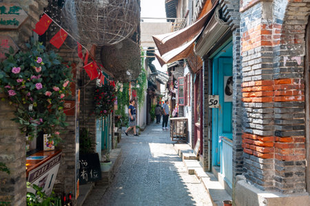 Shanghai, China - September 2019: Old residential buildings transformed into shops and restaurants along the alleys in Zhujiajiao Ancient Water Town, a historic village and famous tourist destination in Qingpu District of Shanghai, Chinaのeditorial素材