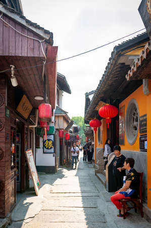 Shanghai, China - September 2019: Old residential buildings transformed into shops and restaurants along the alleys in Zhujiajiao Ancient Water Town, a historic village and famous tourist destination in Qingpu District of Shanghai, Chinaのeditorial素材