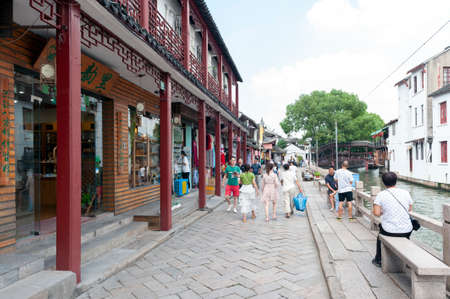 Shanghai, China - September 2019: Old residential buildings transformed into shops and restaurants along the alleys in Zhujiajiao Ancient Water Town, a historic village and famous tourist destination in Qingpu District of Shanghai, Chinaのeditorial素材