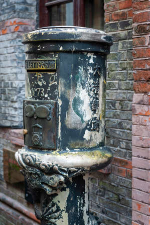 Shanghai, China - September 2019: Ancient postbox in front of Qing Dynasty Post Office Museum in Zhujiajiao Ancient Water Town, a historic village and famous tourist destination in Shanghai, Chinaのeditorial素材