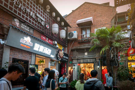 Shanghai, China - September 2019: Tianzifang, a popular tourist destination home to boutique shops, craft stores, trendy art studios, cafes, bars and restaurants along narrow alleys in Shanghai, Chinaのeditorial素材