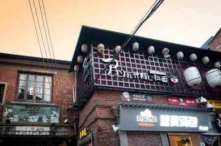 Shanghai, China - September 2019: Old building in Tianzifang renovated from traditional residential area in the French Concession area of Shanghai, China, now home to boutique shops, bars and restaurants.のeditorial素材