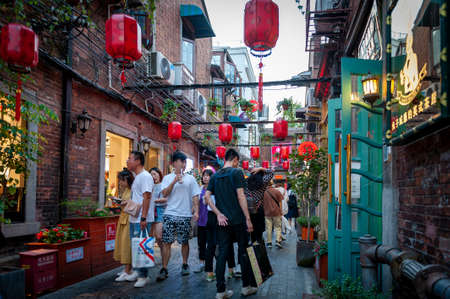 Shanghai, China - September 2019: Tianzifang, a popular tourist destination home to boutique shops, craft stores, trendy art studios, cafes, bars and restaurants along narrow alleys in Shanghai, Chinaのeditorial素材