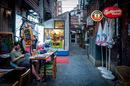 Shanghai, China - September 2019: Tianzifang, a popular tourist destination home to boutique shops, craft stores, trendy art studios, cafes, bars and restaurants along narrow alleys in Shanghai, Chinaのeditorial素材