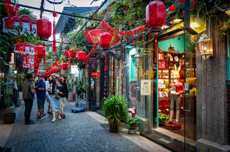 Shanghai, China - September 2019: Tianzifang, a popular tourist destination home to boutique shops, craft stores, trendy art studios, cafes, bars and restaurants along narrow alleys in Shanghai, Chinaのeditorial素材