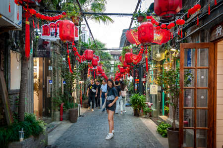 Shanghai, China - September 2019: Tianzifang, a popular tourist destination home to boutique shops, craft stores, trendy art studios, cafes, bars and restaurants along narrow alleys in Shanghai, Chinaのeditorial素材