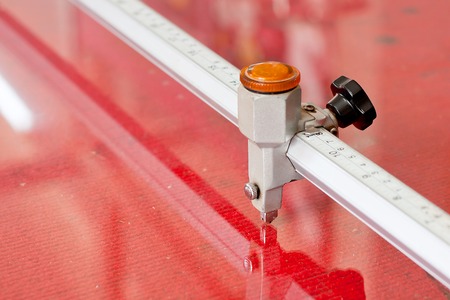 Glass cutting on the red working tableの写真素材