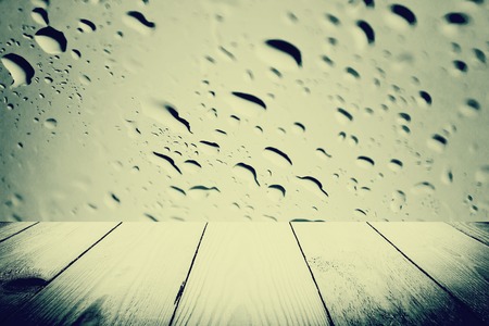 Vintage style - Abstract rain drops on a window or water drops on grass and wood backgroundの写真素材