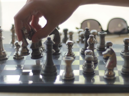 concept of Man playing silver chessの写真素材