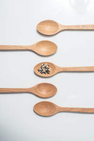 Wooden spoon isolated on white backgroundの写真素材