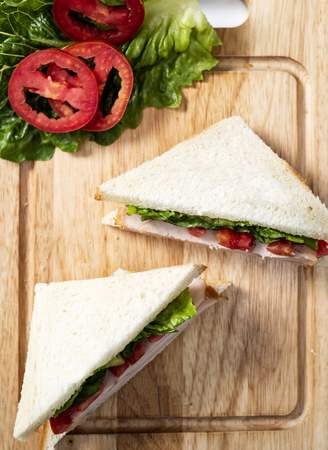 Club Sandwich on wood Chopping boardの写真素材