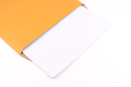 Brown envelope and blank document on white isolatedの写真素材