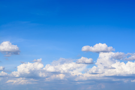 Blue sky background with white cloudsの写真素材