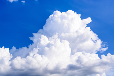 Blue sky background with white cloudsの写真素材