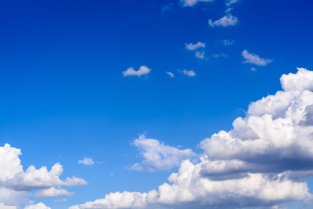 Blue sky background with white cloudsの写真素材