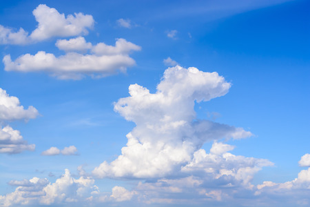 Blue sky background with white cloudsの写真素材
