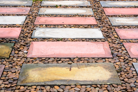 a rectangular brick walkway and pebbleの写真素材