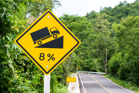 Asphalt roads in the forest and Road signsの写真素材