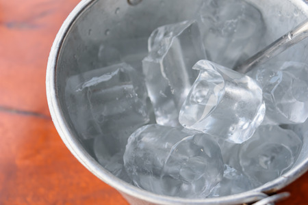 closeup ice bucket on wooden tableの写真素材