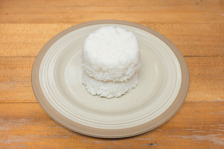 double cooked rice on a plate on wooden tableの写真素材