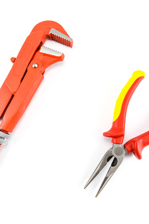red wrench and pliers isolated on white backgroundの写真素材