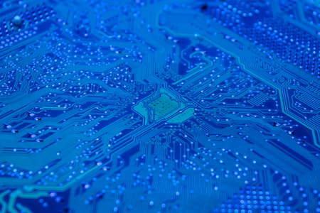 closeup and detail of a blue circuit boardの写真素材